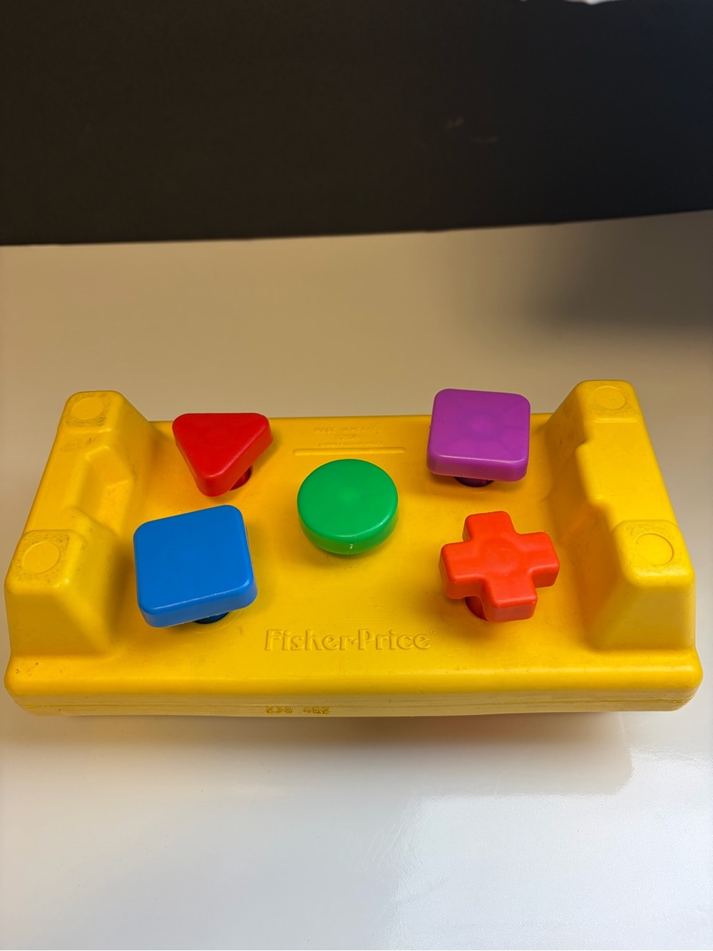 Fisher-Price Yellow Shape Sorter Toy with Multicolor Buttons